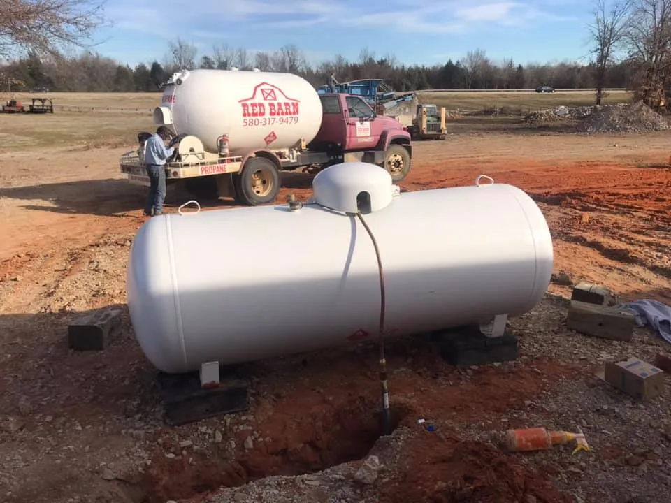 Red Barn installing a propane tank at a local property